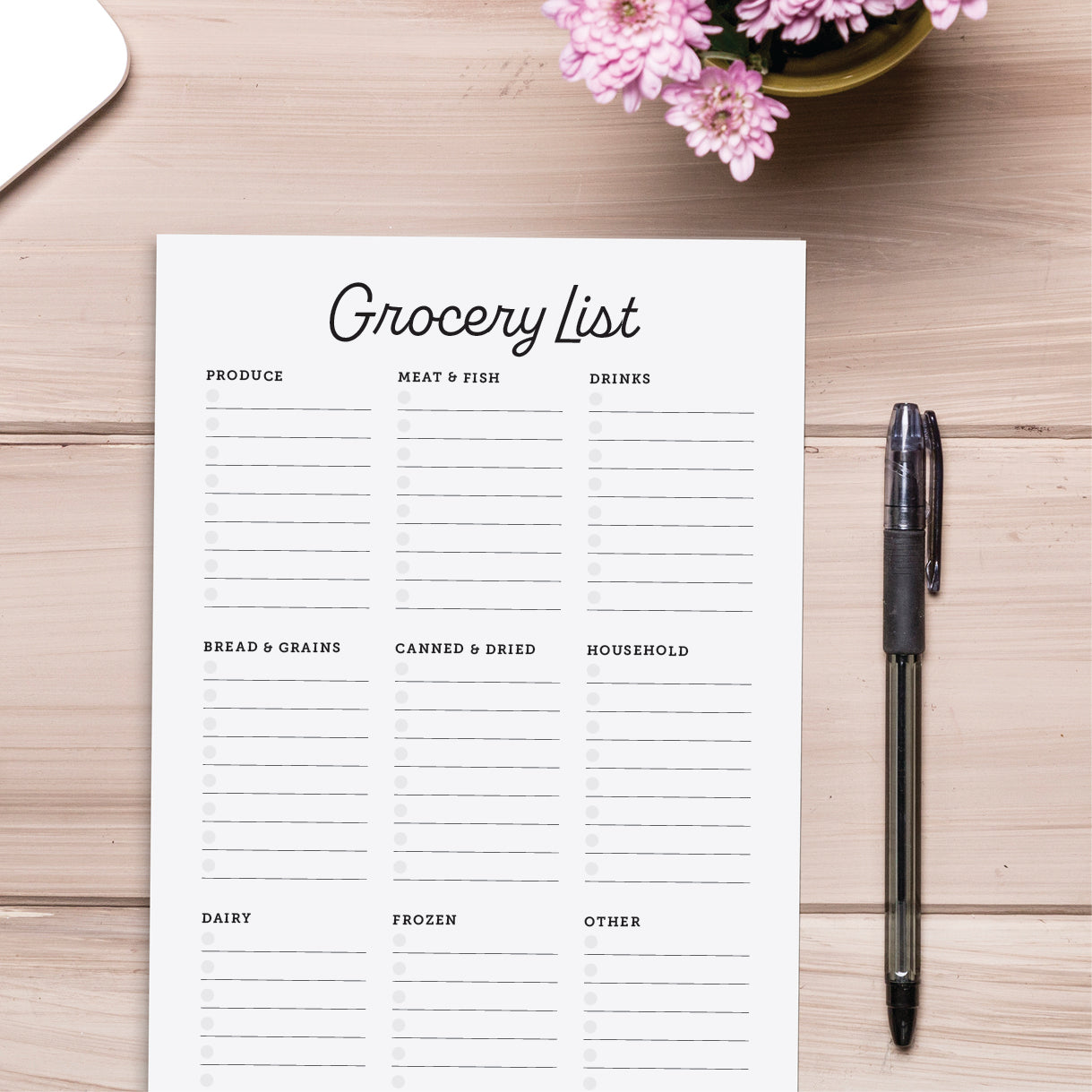 cardamonoly grocery list planning pad on wood desk