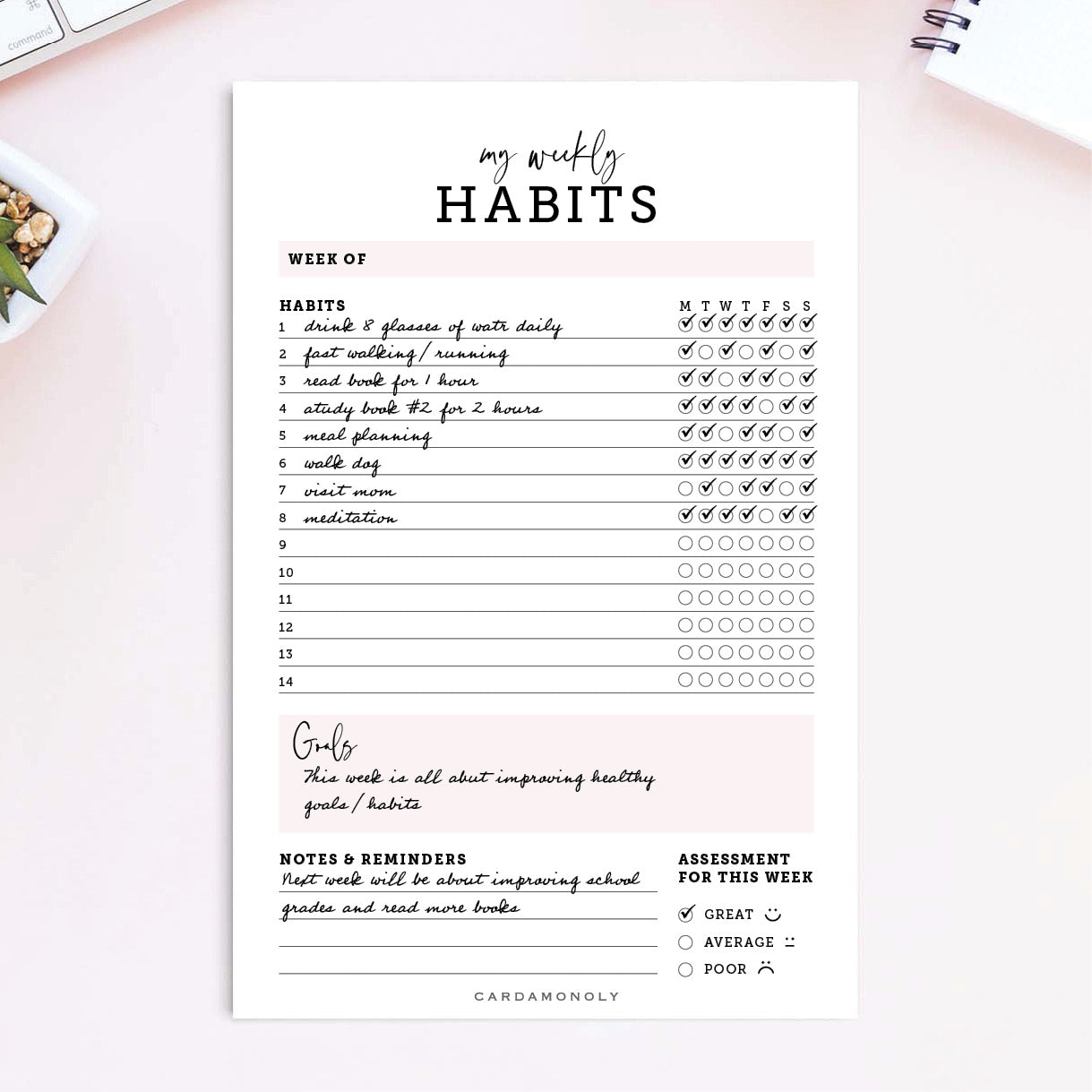 pink habit tracker notepapad 6 x 9 on pink work desk